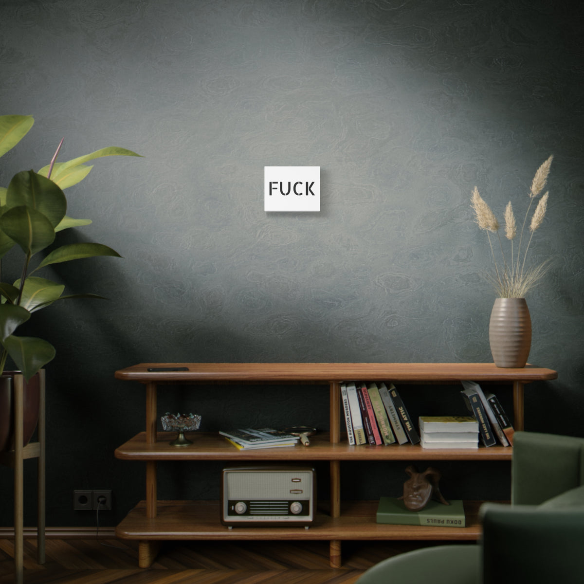 White stretched canvas printed with large minimalist black FUCK typography