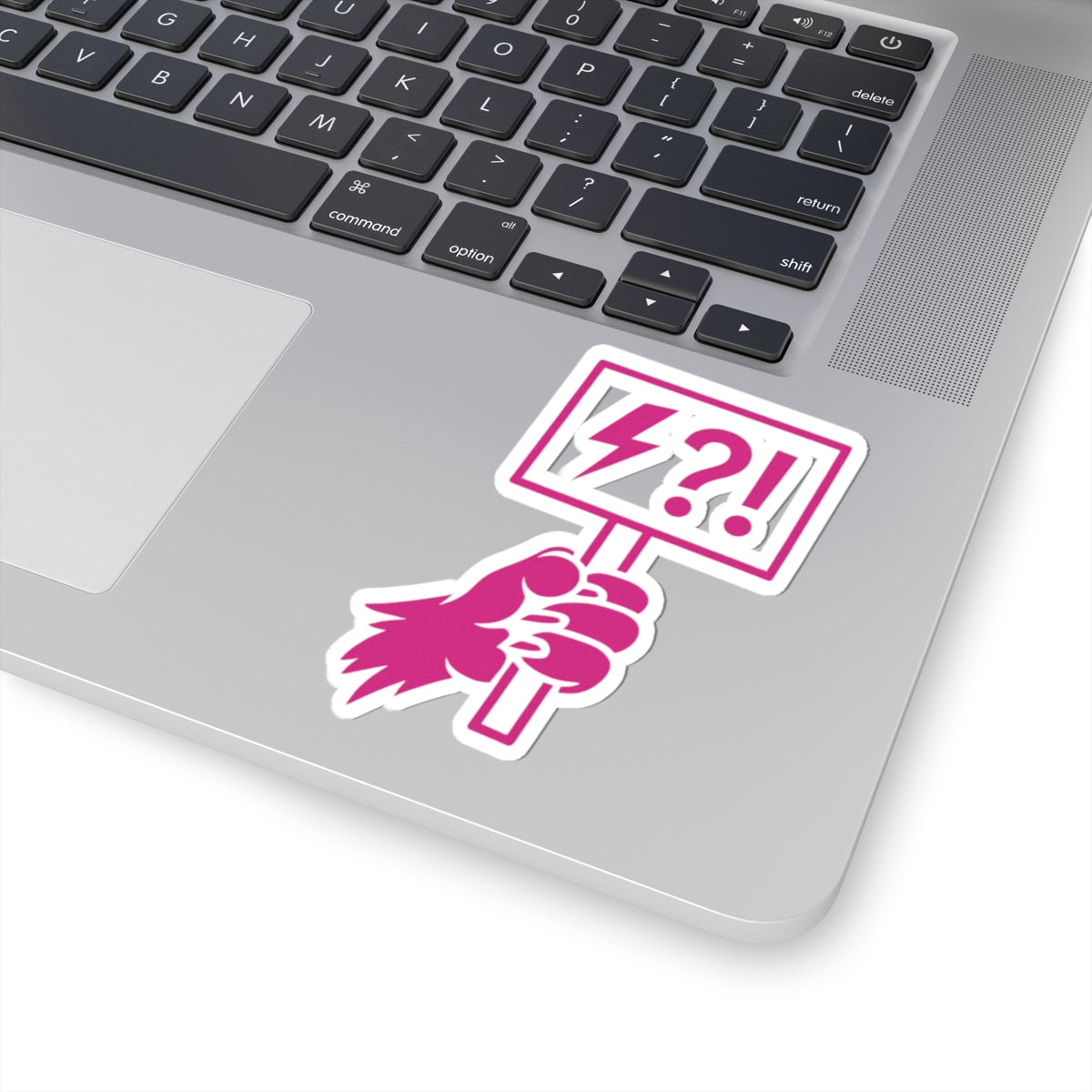 Pink illustrated animal hand holding a protest sign filled with lightning and punctuation