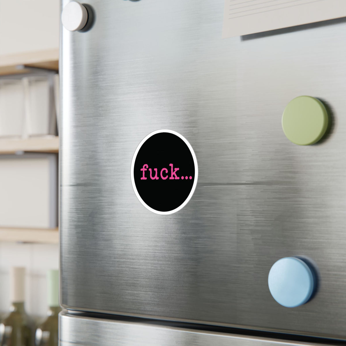 Round black vinyl sticker with lowercase motel-pink fuck and an ellipsis