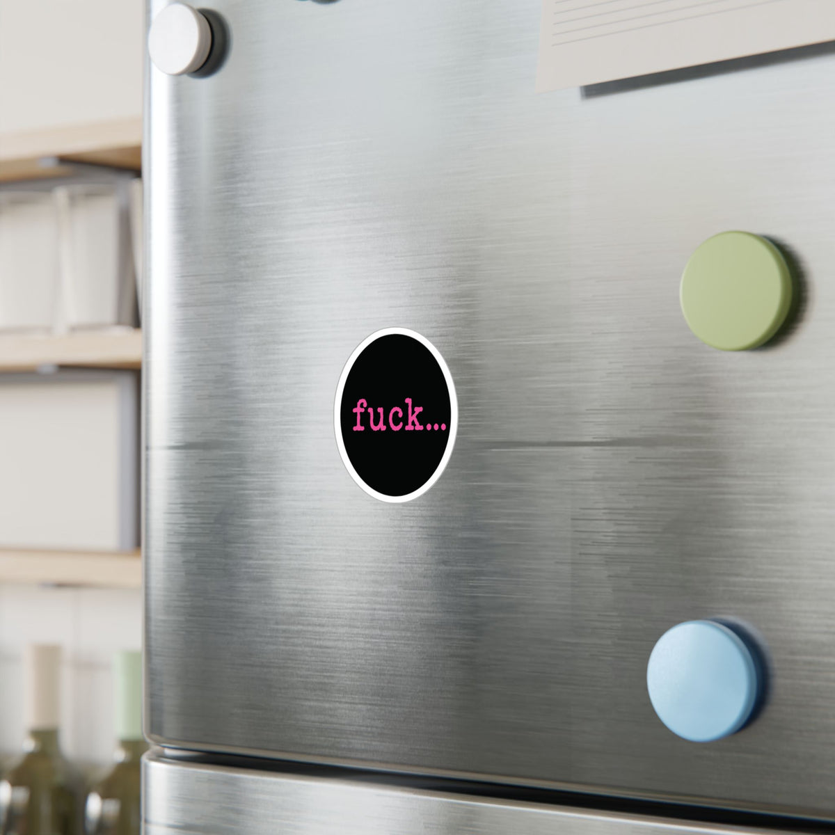 Round black vinyl sticker with lowercase motel-pink fuck and an ellipsis
