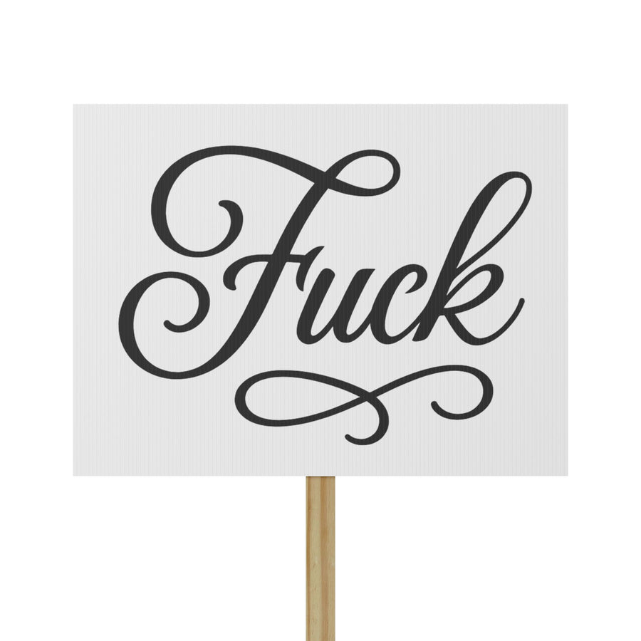 White protest sign with black script FUCK lettering mounted on a pine wood handle