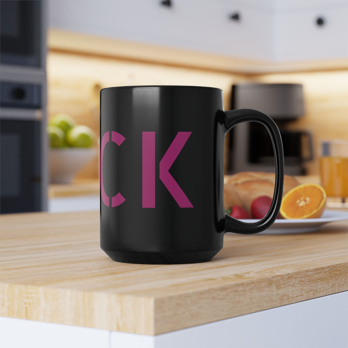 Glossy black 15-ounce mug with oversized motel-pink FUCK typography wrapping around it