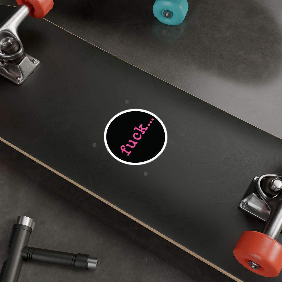 Round black vinyl sticker with lowercase motel-pink fuck and an ellipsis