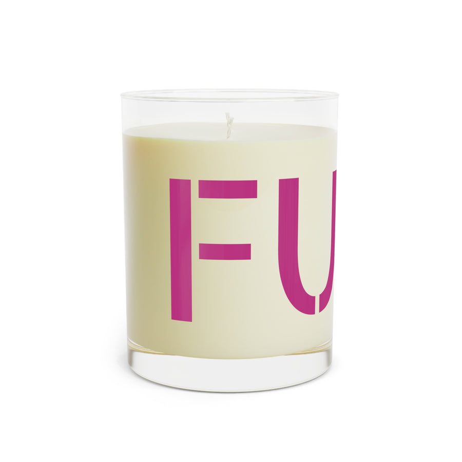 Glass candle with oversized motel-pink FUCK typography on a cream label