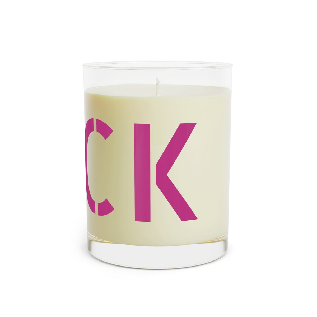 Glass candle with oversized motel-pink FUCK typography on a cream label