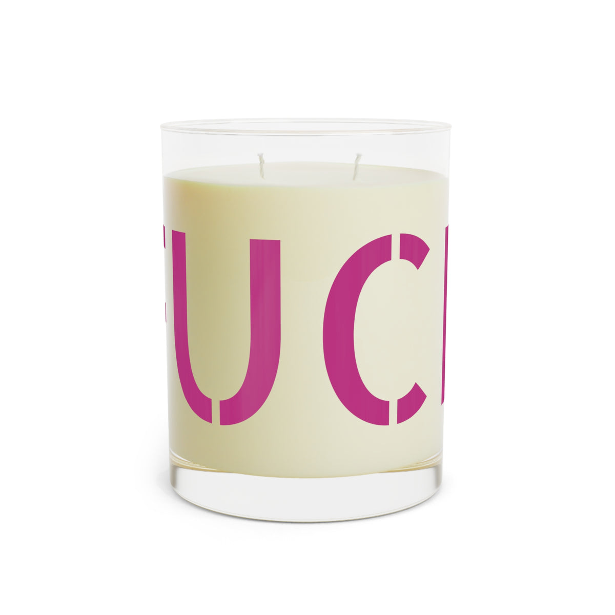 Glass candle with oversized motel-pink FUCK typography on a cream label