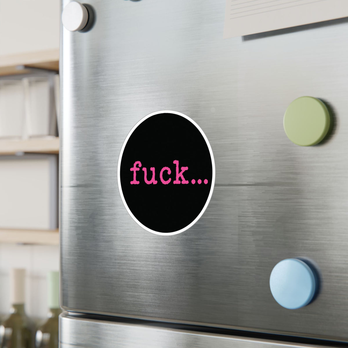 Round black vinyl sticker with lowercase motel-pink fuck and an ellipsis