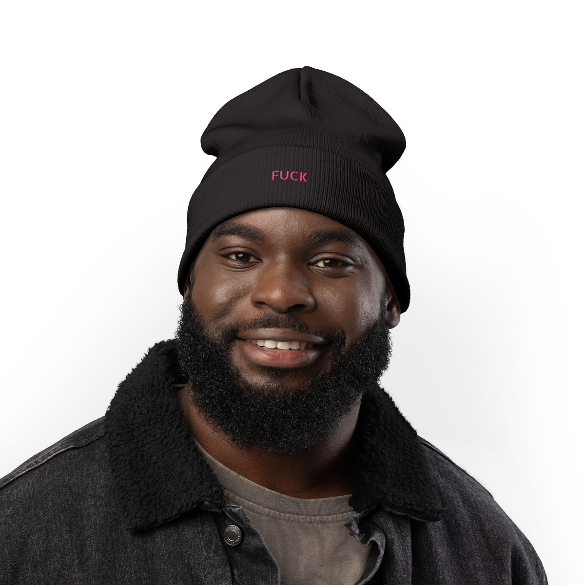Black cuffed knit beanie embroidered with tiny pink FUCK lettering