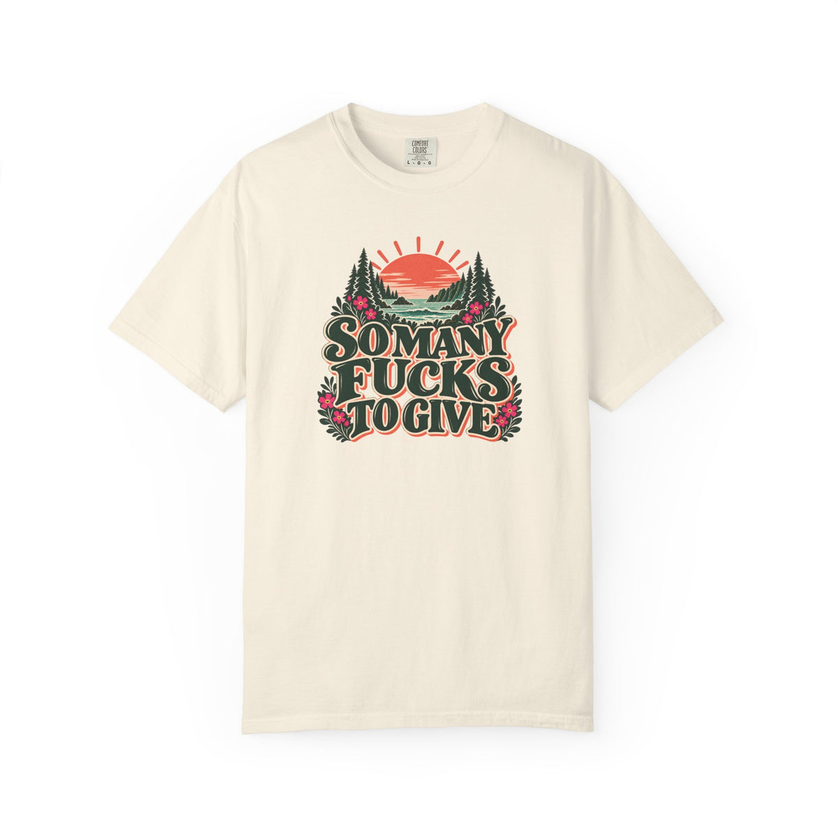 Model wearing an Ivory So Many Fucks to Give retro graphic tee with a coral sun, evergreen redwoods, coastal waves, and pink wildflowers.

