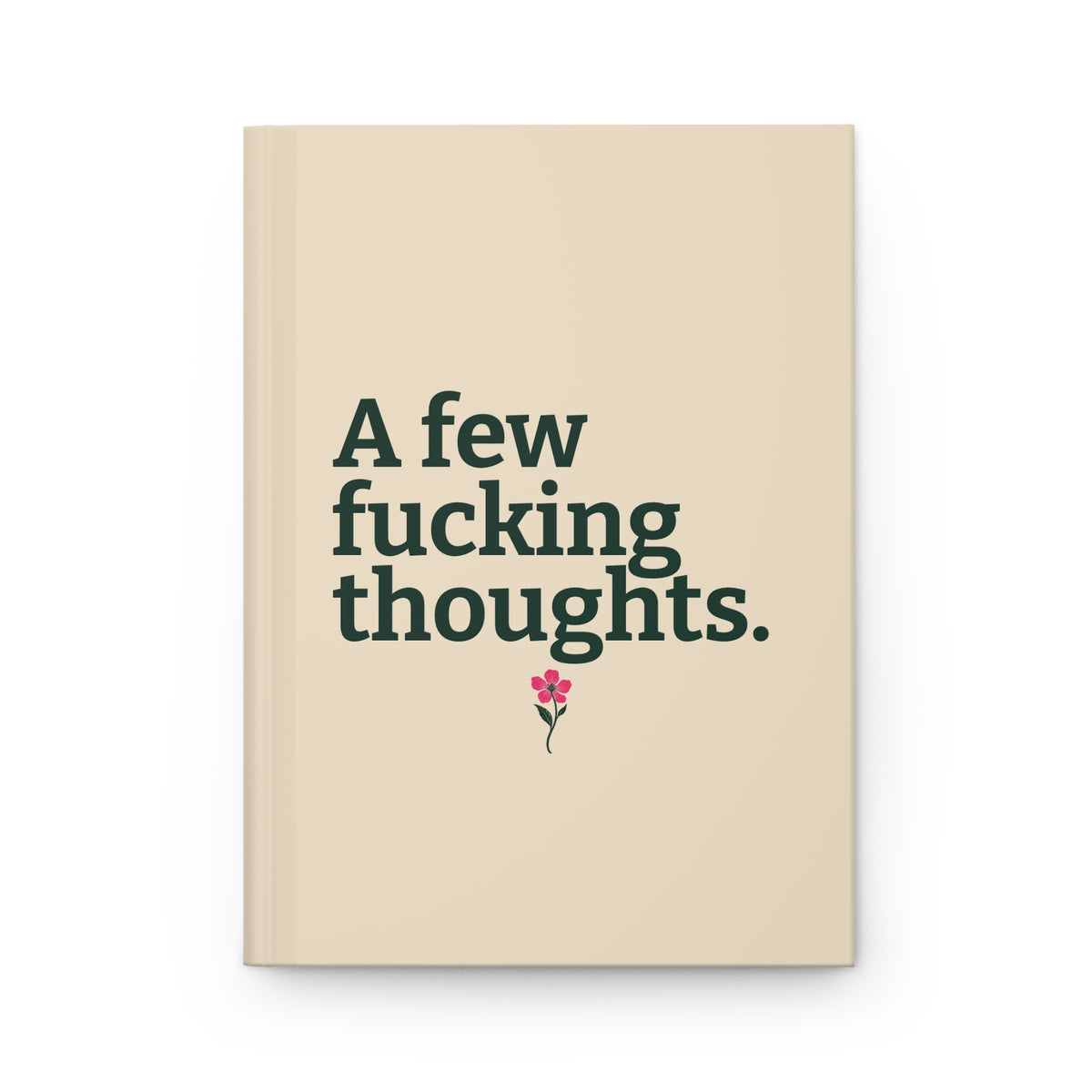 Cream hardcover journal with evergreen lettering reading A few fucking thoughts. and a small pink wildflower beneath the text.