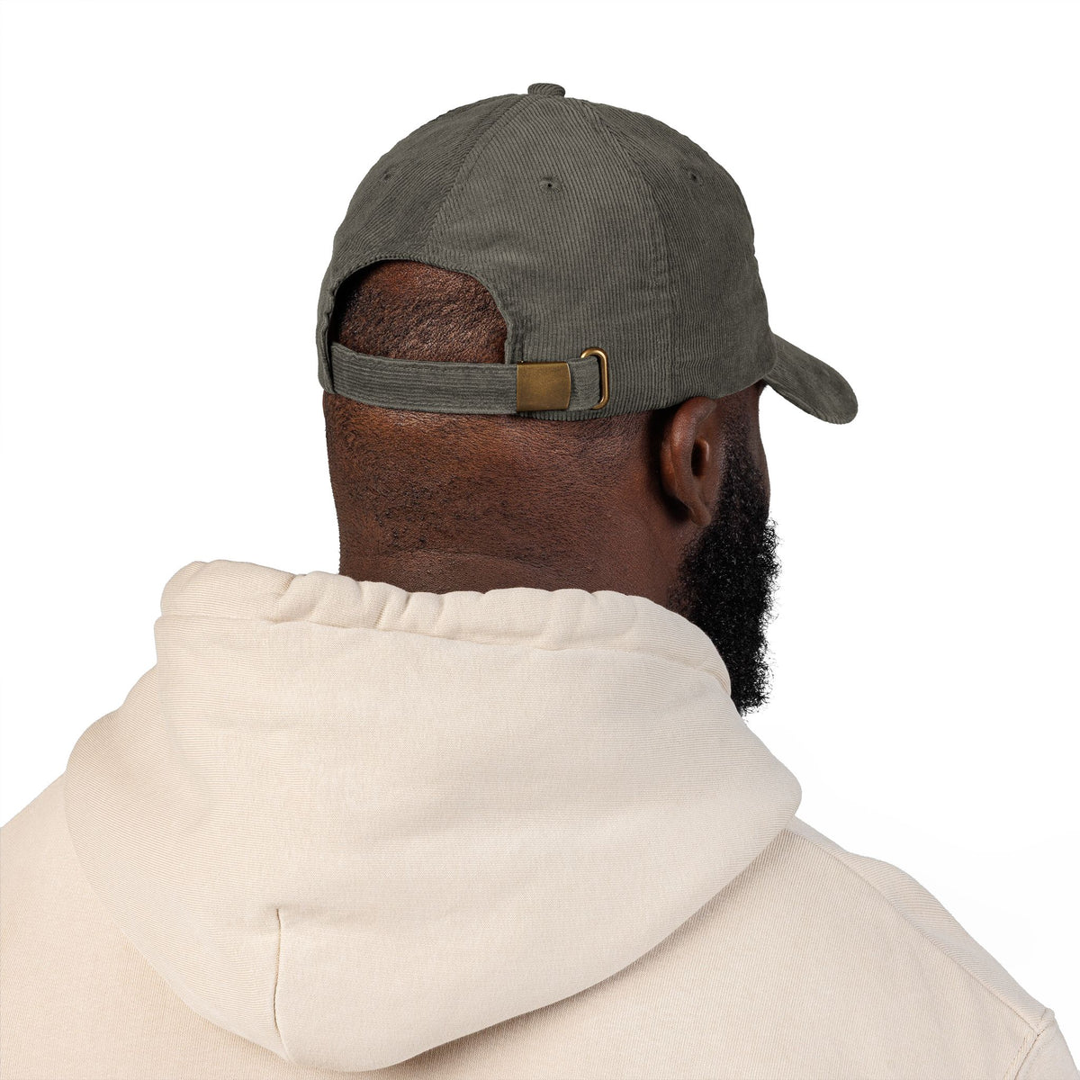 Brown corduroy cap embroidered with small motel-pink FUCK lettering